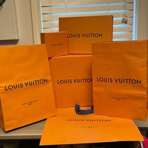 100% Authentic LV Louis Vuitton Assortment of shopping bags and boxes.